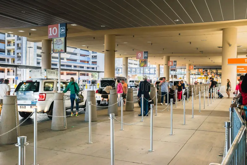 Airport transportation pickup area representing Jitney Shuttle services to PHL, EWR, and ACY